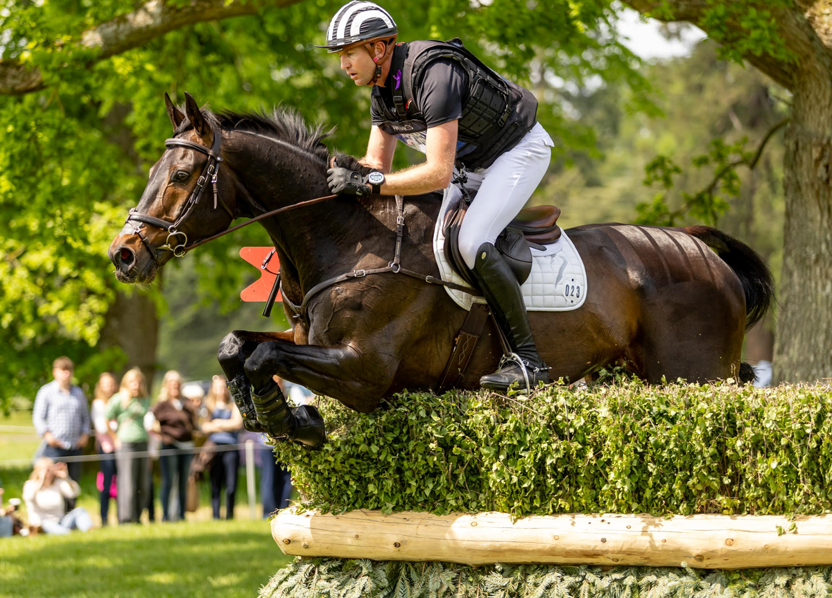 Jesse Campbell riding cross country in a black Point Two air vest.