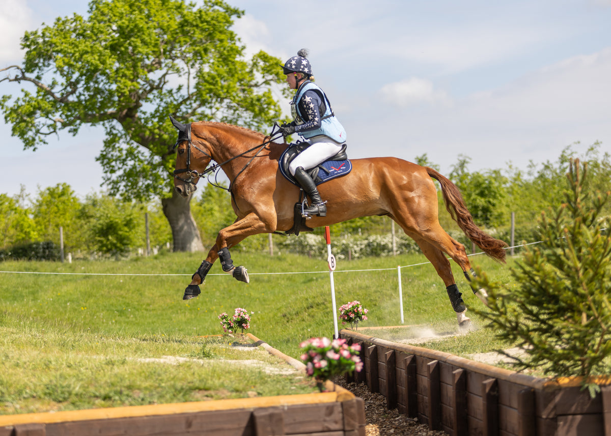 Ellie Nicholson wearing her baby blue Point Two Pro-Air vest cross country.